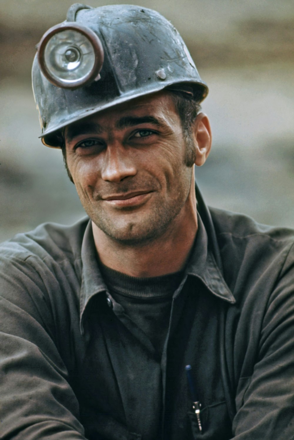Smiling HomeTrades tradesperson in a hard hat